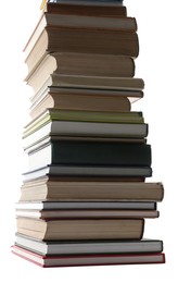 Photo of High stack of many different books isolated on white