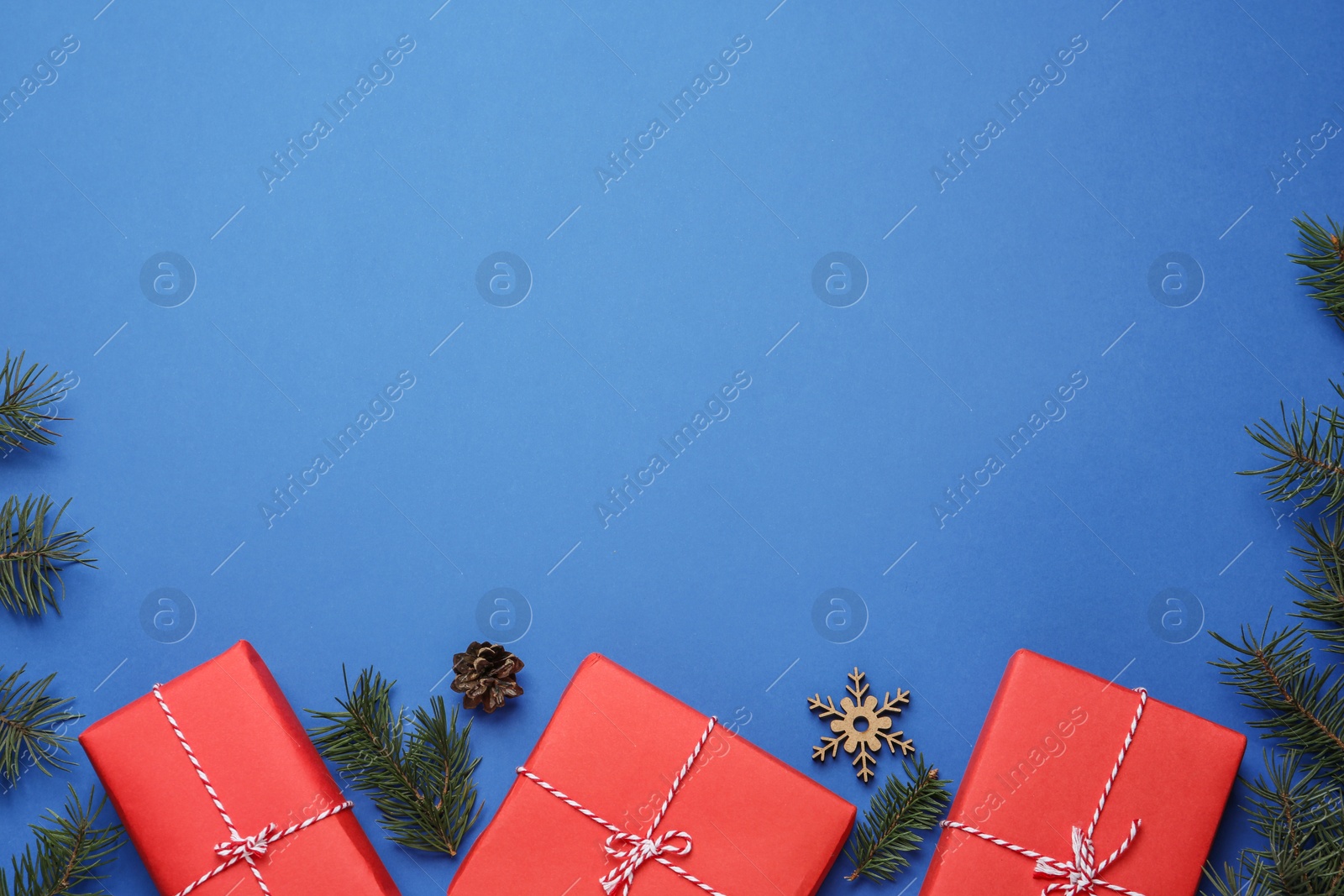 Photo of Flat lay composition with Christmas gifts on blue background, space for text. Boxing day