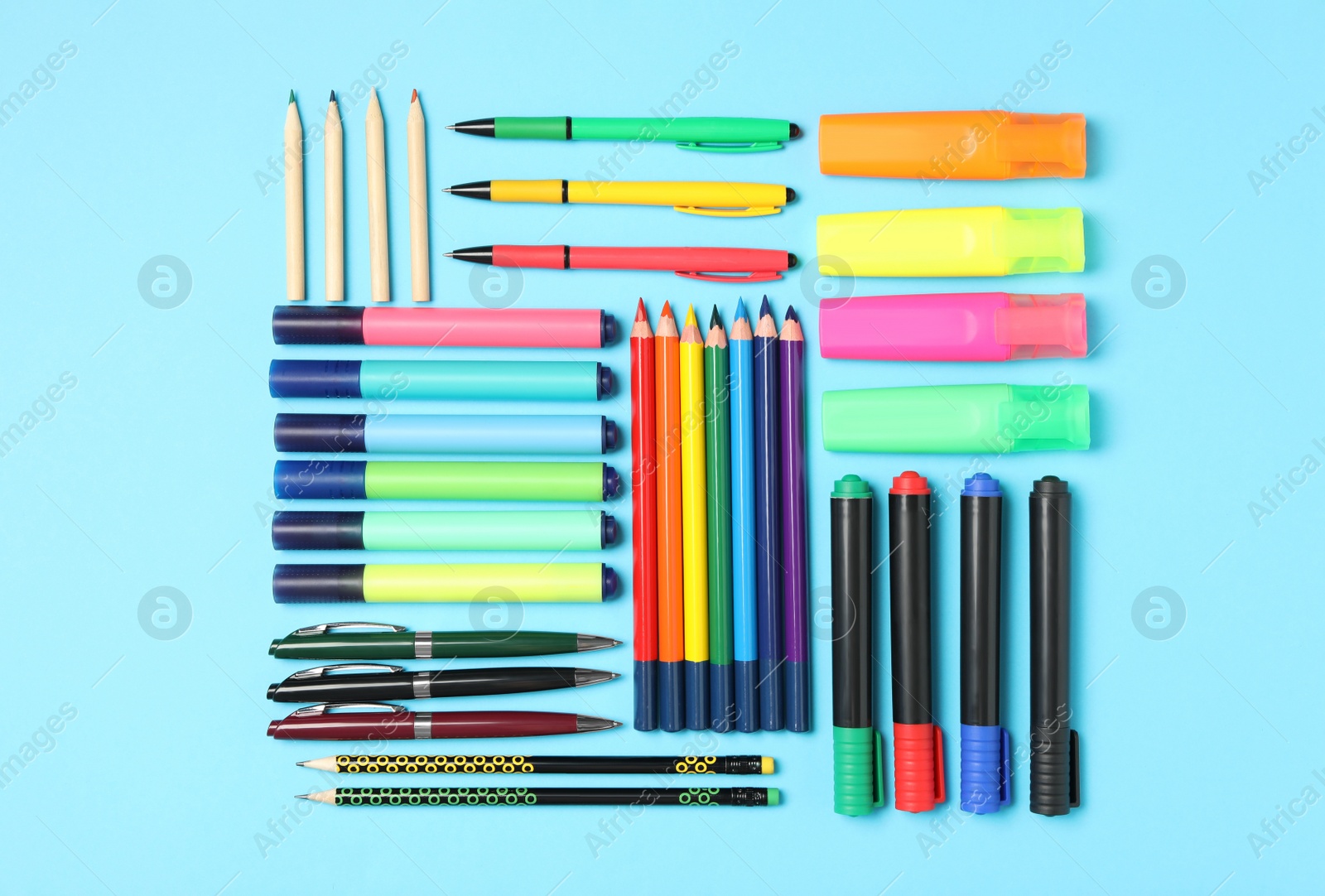 Photo of Different stationery on light blue background, flat lay. Back to school