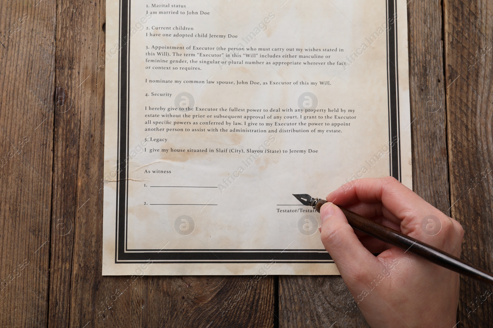 Photo of Woman signing Last Will and Testament at wooden table, top view