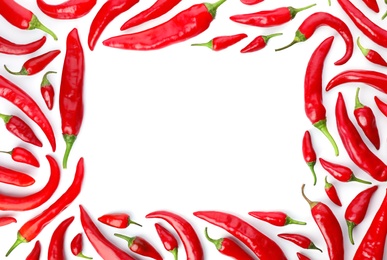 Photo of Frame made of red chili peppers on white background, top view. Space for text