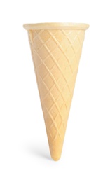 Photo of Empty wafer ice cream cone on white background