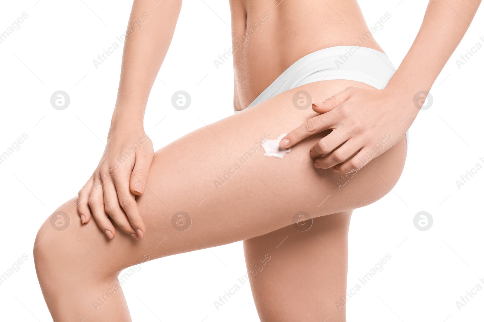 Photo of Young woman applying body cream on white background