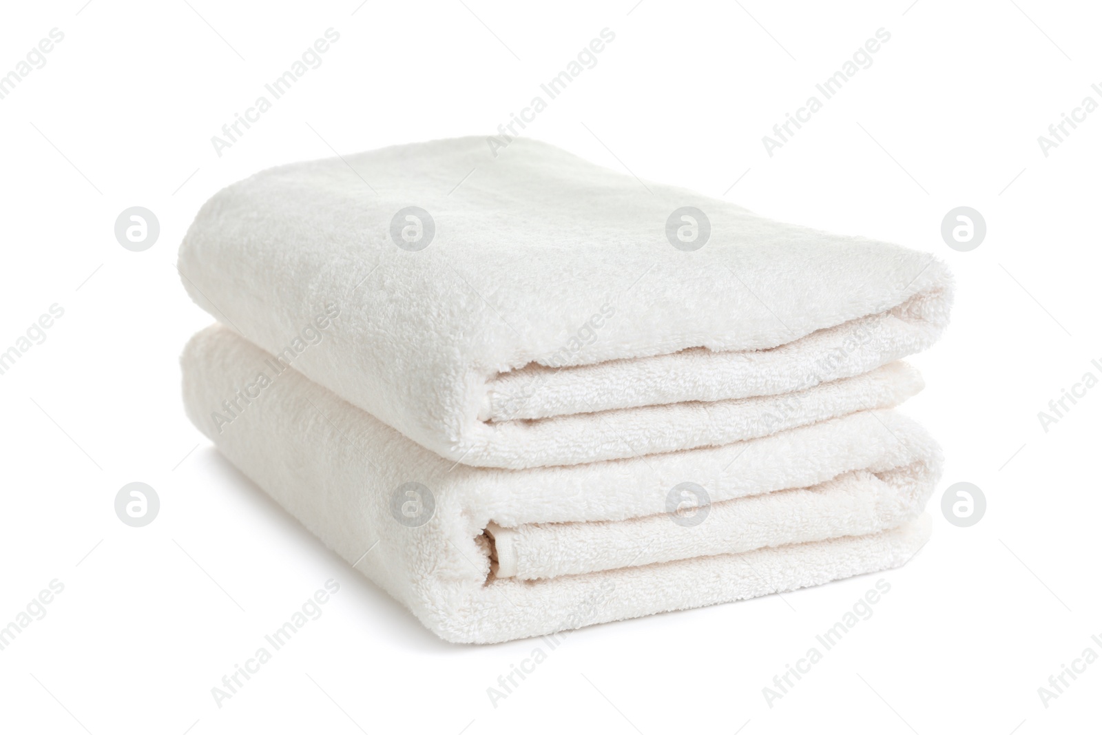 Photo of Folded clean soft towels on white background