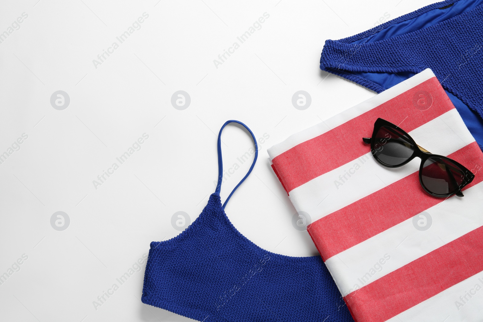 Photo of Flat lay composition with different beach objects on white background, space for text