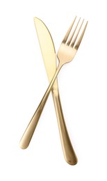 Photo of Shiny golden fork and knife isolated on white. Luxury cutlery