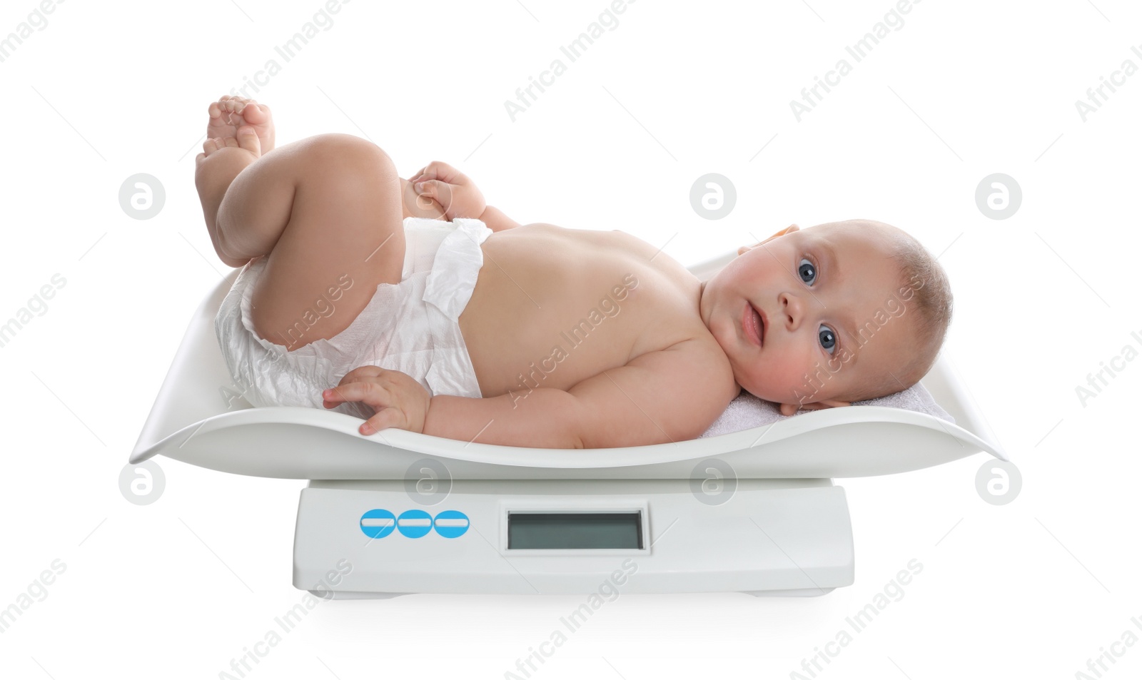 Photo of Cute little baby lying on scales against white background