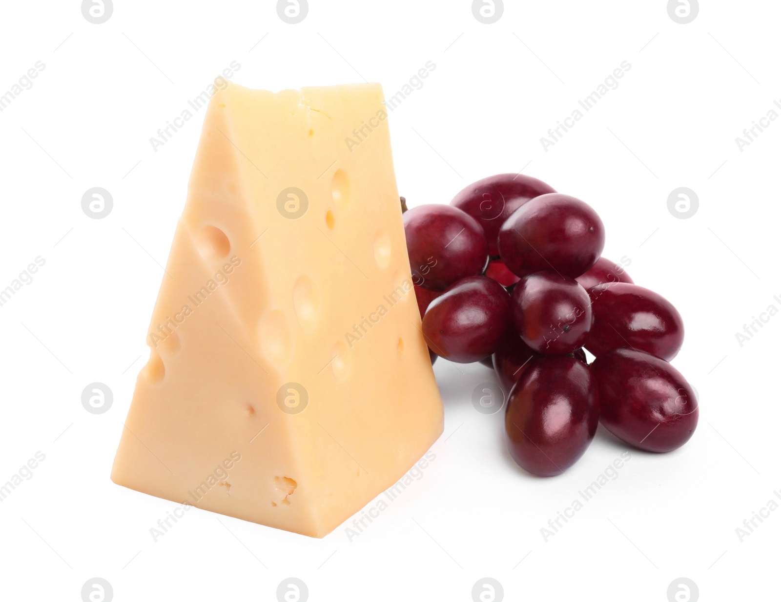 Photo of Piece of delicious cheese and grapes isolated on white