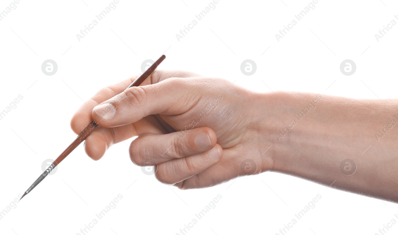 Photo of Man holding paint brush on white background, closeup