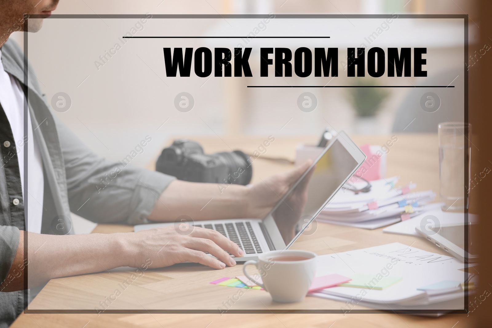 Image of Man using modern laptop at table, closeup. Work from home