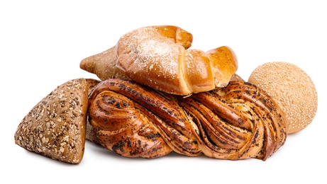 Photo of Fresh breads and pastries on white background