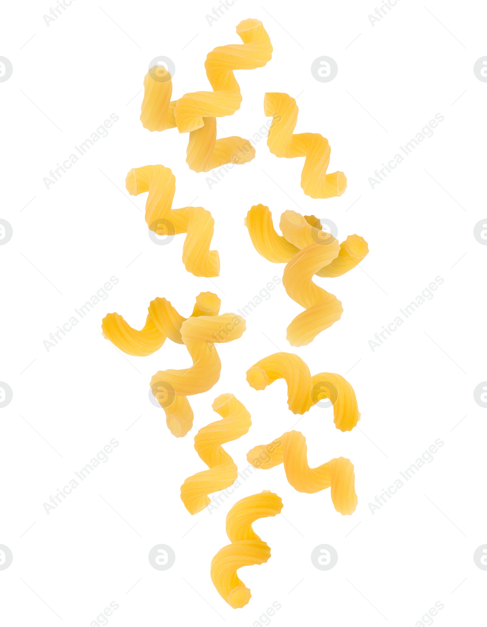 Image of Raw cavatappi pasta falling on white background