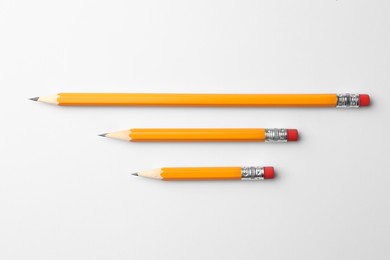 Photo of Sharp graphite pencils on white background, flat lay