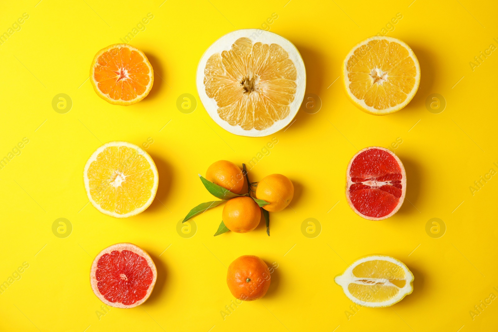 Photo of Different citrus fruits on color background, flat lay