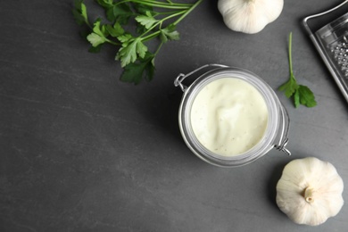 Photo of Flat lay composition with garlic sauce on grey background. Space for text