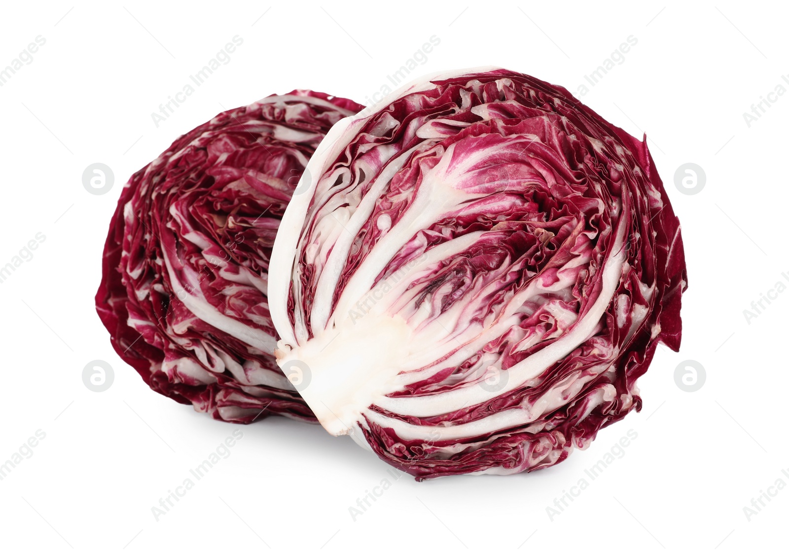 Photo of Halves of ripe radicchio on white background