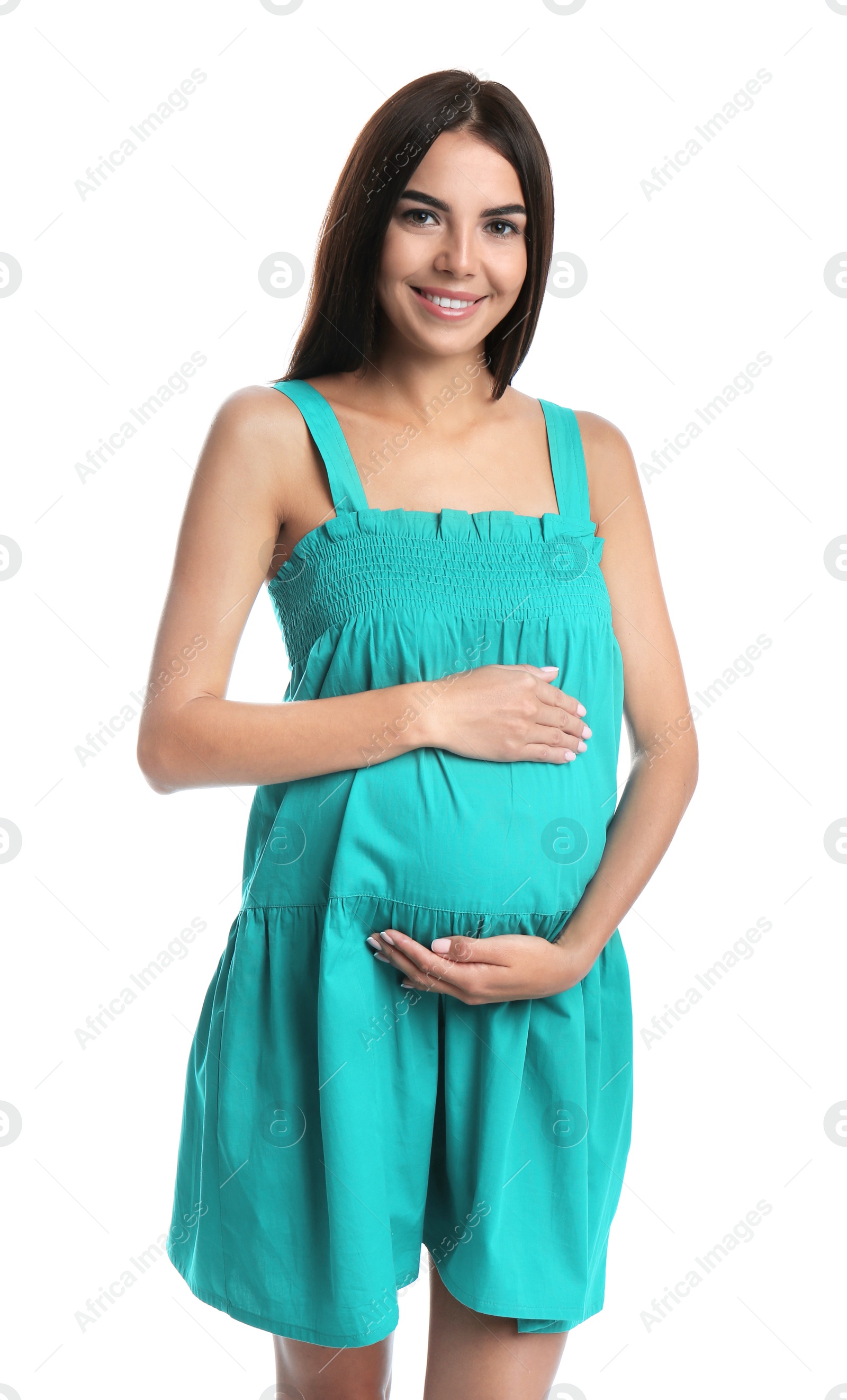 Photo of Happy pregnant woman holding her belly on white background