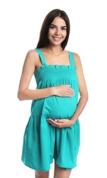 Happy pregnant woman holding her belly on white background