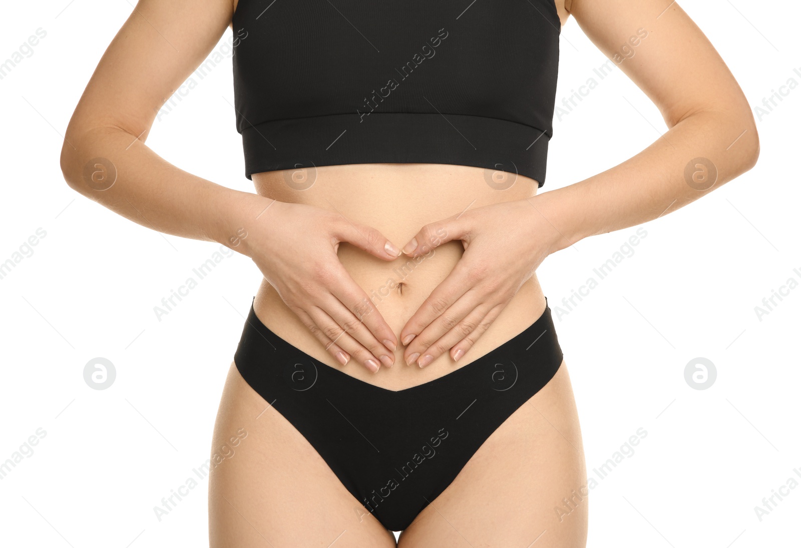 Photo of Gynecology. Woman in underwear making heart with her hands on white background, closeup