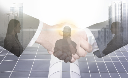 Image of Multiple exposure of business people, partners shaking hands and cityscape