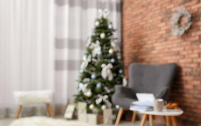 Photo of Blurred view of stylish living room interior with decorated Christmas tree