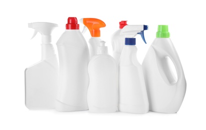 Photo of Bottles of different cleaning products on white background