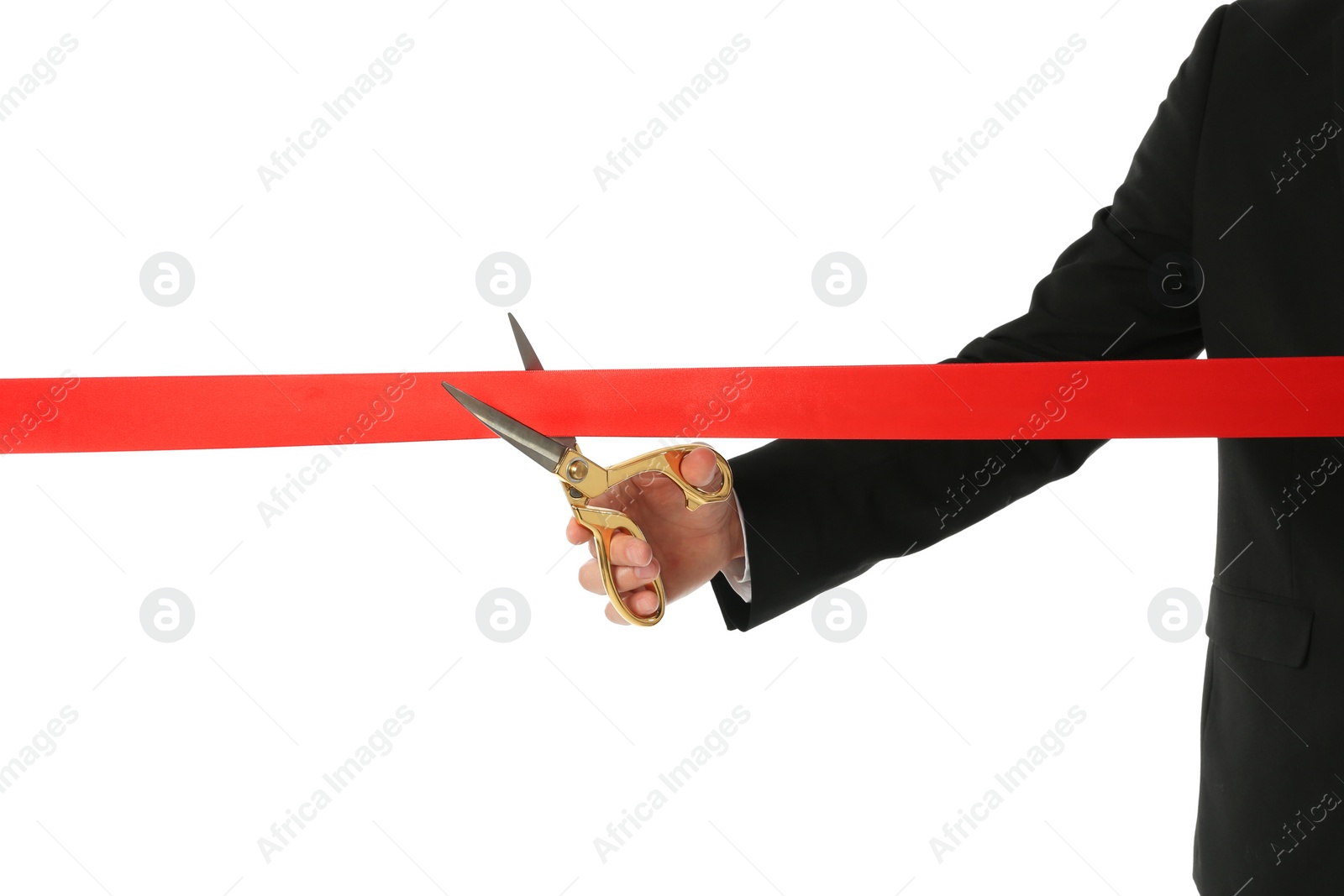 Photo of Man in office suit cutting red ribbon isolated on white, closeup