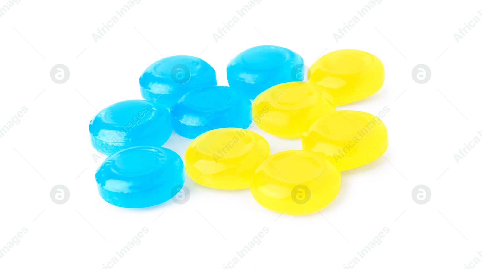 Photo of Many colorful cough drops on white background