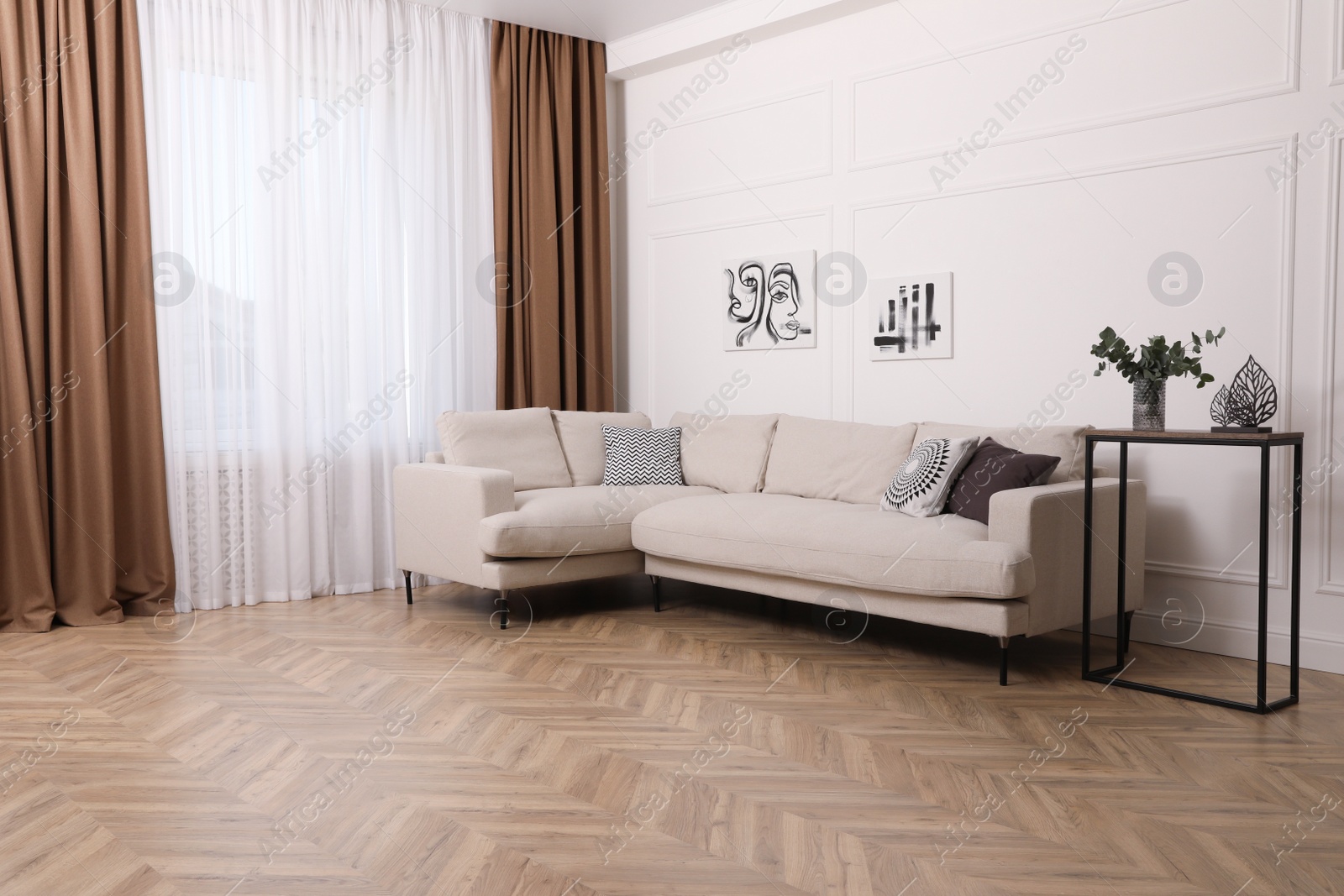 Photo of Modern living room with parquet flooring and stylish furniture