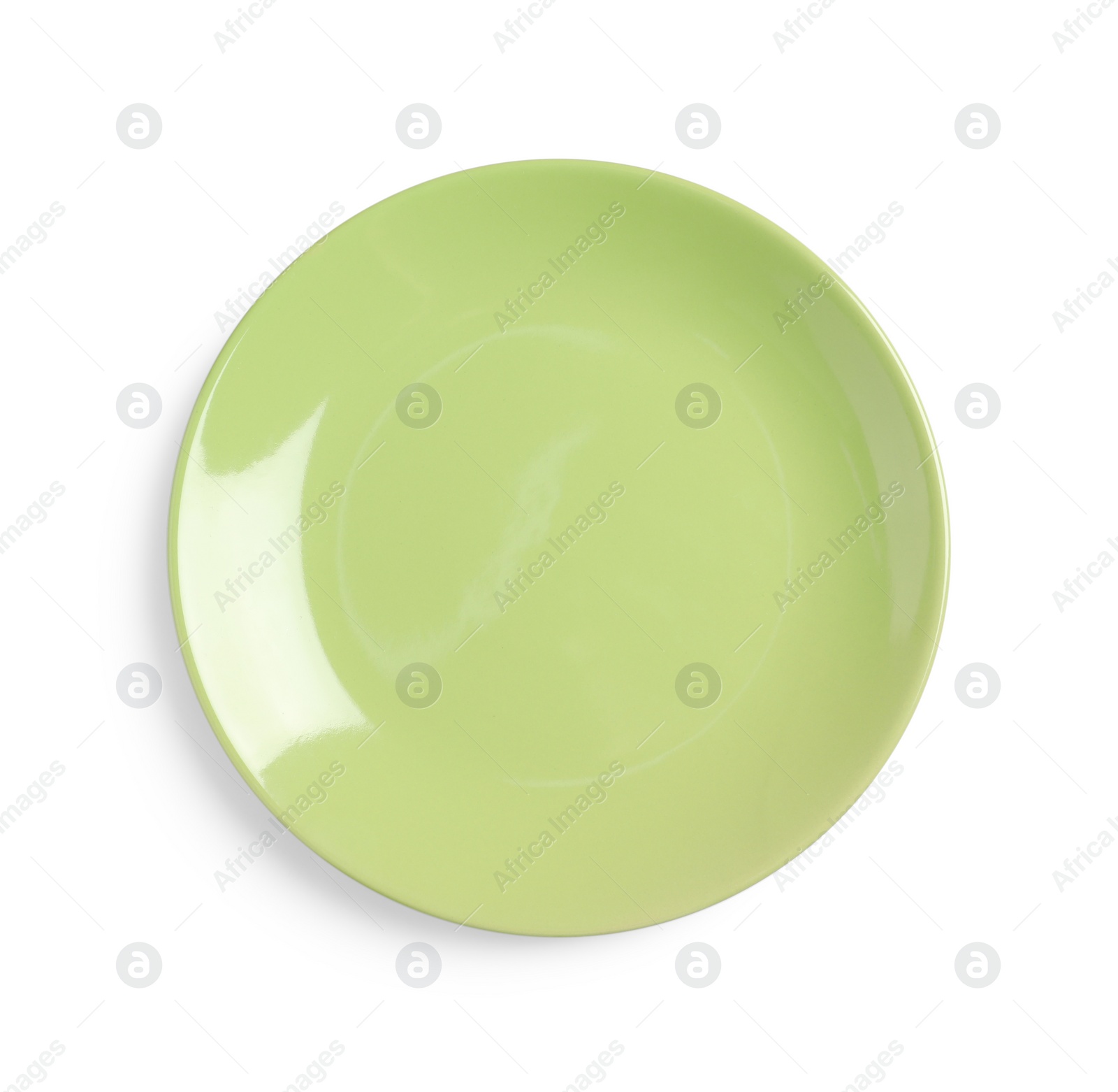 Photo of Green ceramic plate isolated on white, top view