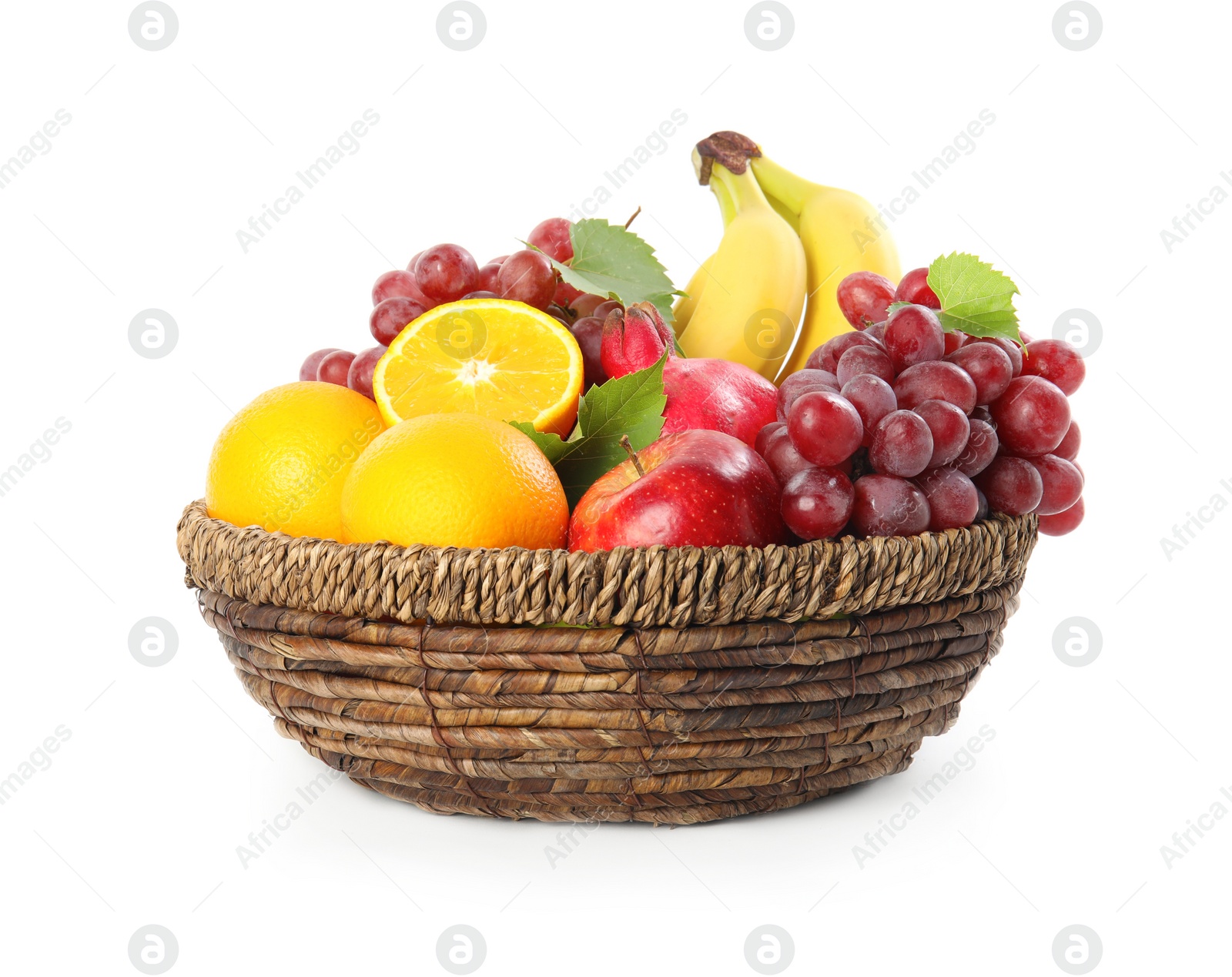 Photo of Wicker basket with different fruits on white background