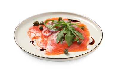 Photo of Delicious salmon carpaccio with arugula, capers and onion on white background