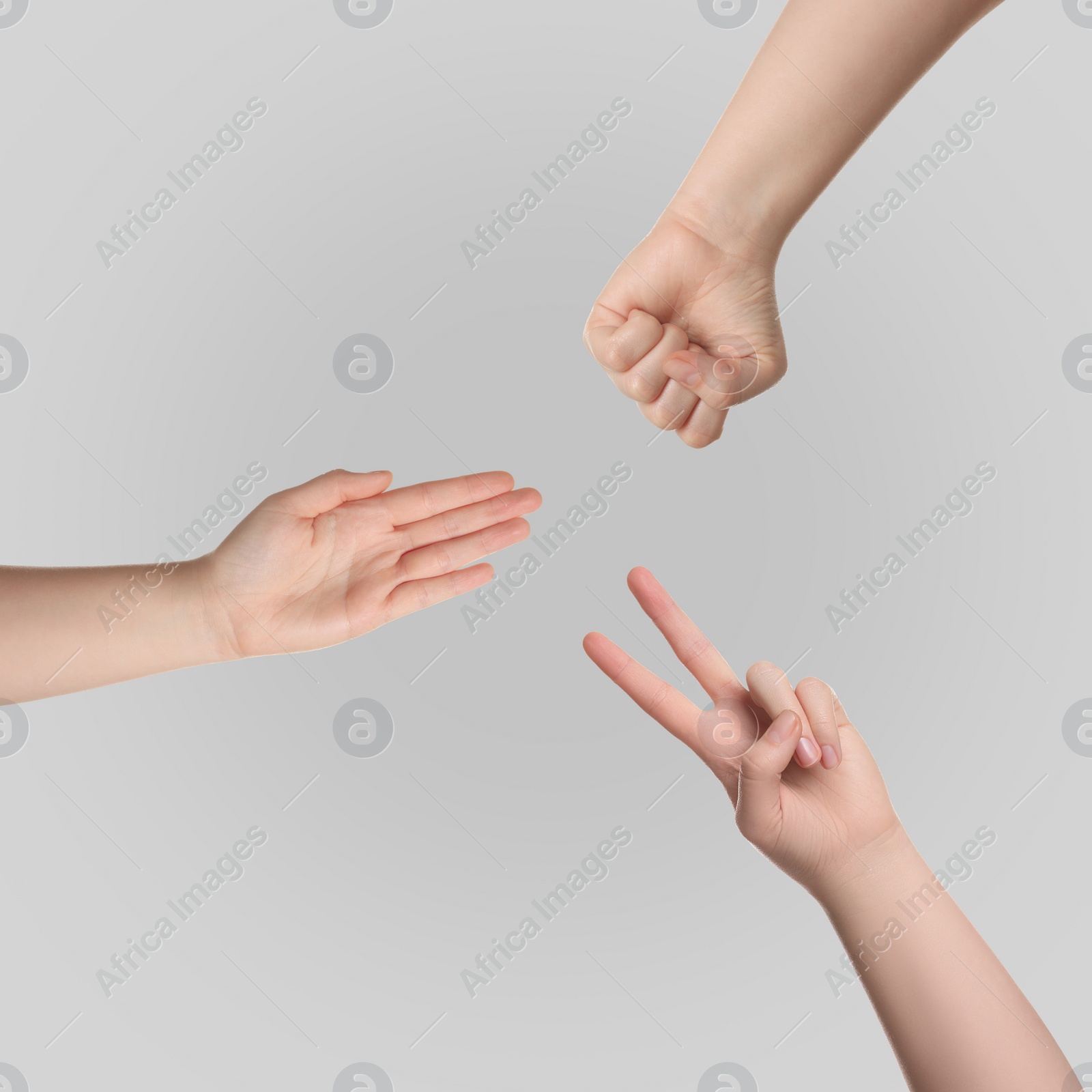 Image of People playing rock, paper and scissors on grey background, top view