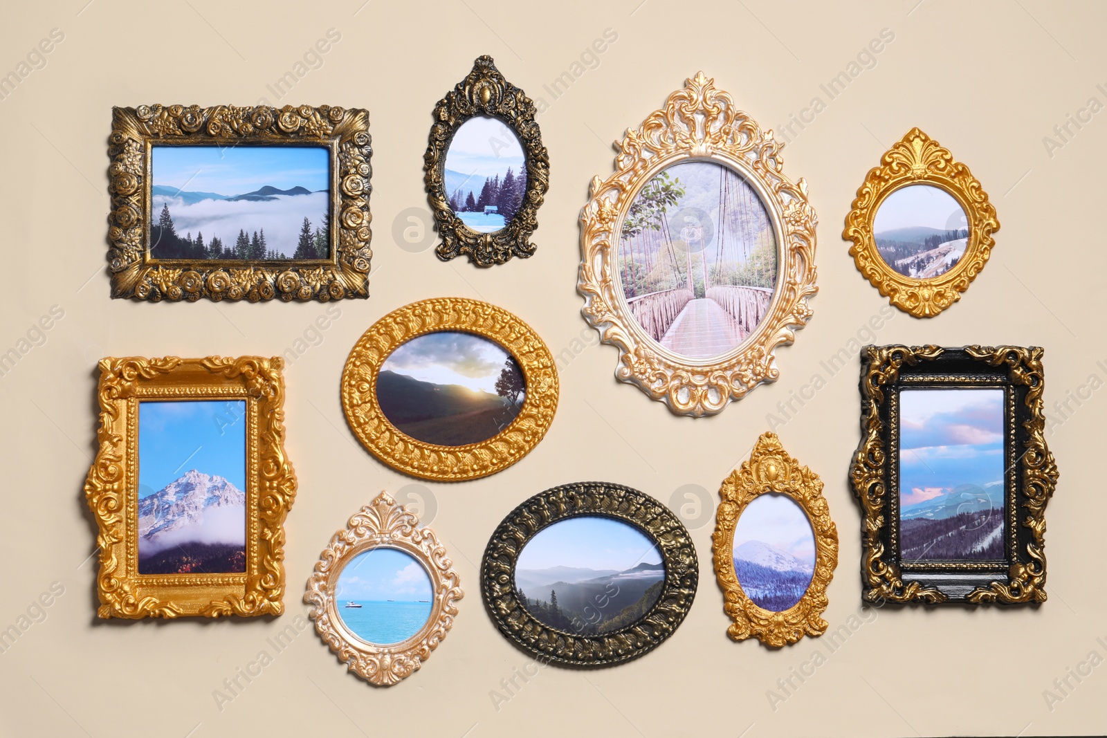 Photo of Vintage frames with photos of beautiful landscapes hanging on beige wall