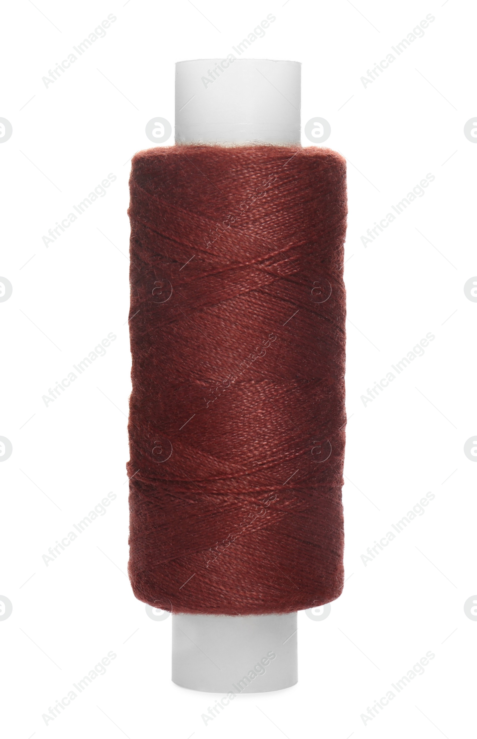 Photo of Spool of dark red sewing thread isolated on white