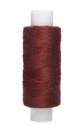 Spool of dark red sewing thread isolated on white