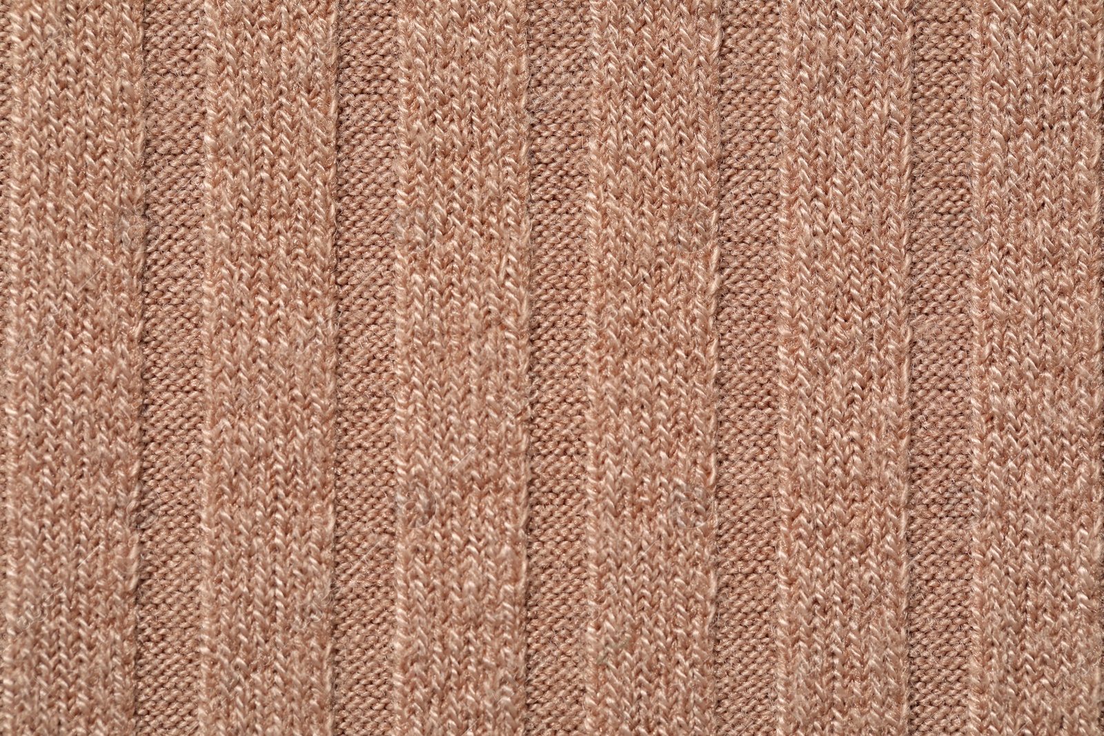 Photo of Texture of soft beige fabric as background, top view