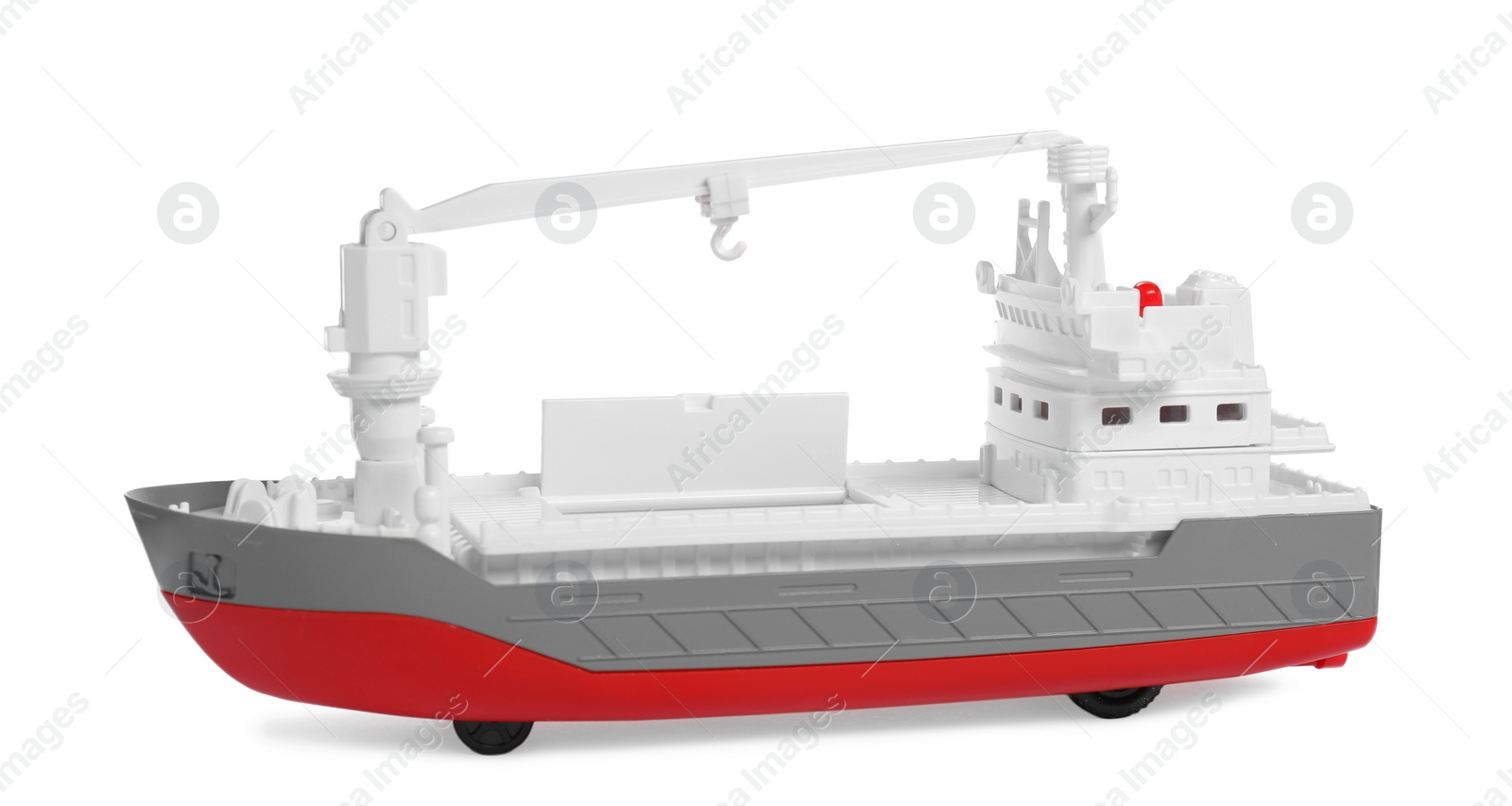 Photo of Toy cargo vessel isolated on white. Export concept