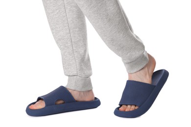 Man in blue slippers on white background, closeup