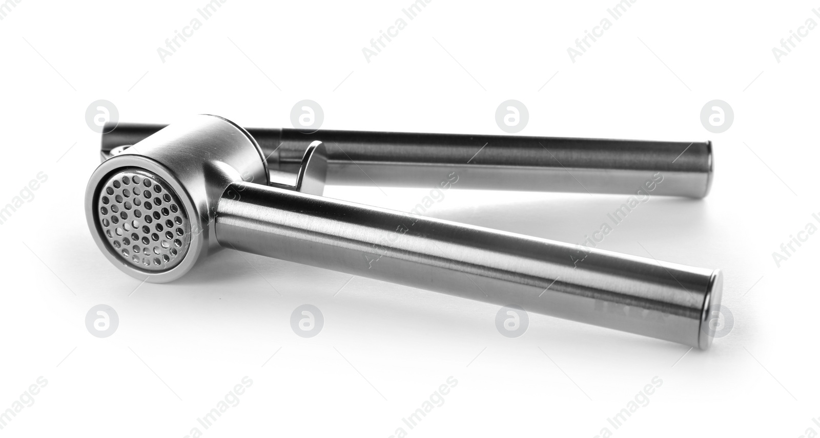 Photo of Garlic press on white background. Kitchen utensil