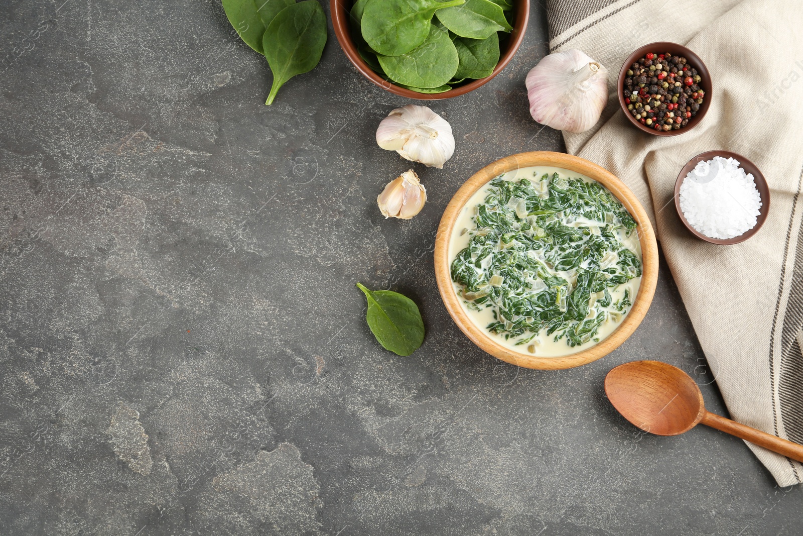 Photo of Tasty spinach dip on grey table, flat lay. Space for text