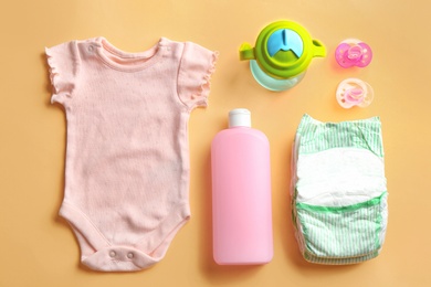 Photo of Flat lay composition with baby accessories on color background