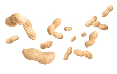 Image of Unpeeled peanuts in air on white background