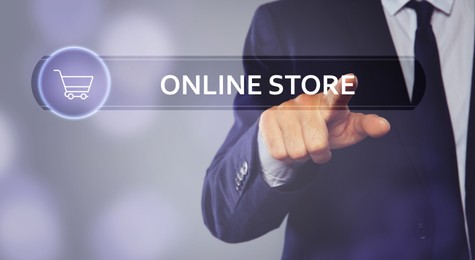 Image of Man pointing at search bar with phrase Online Store on virtual screen, closeup