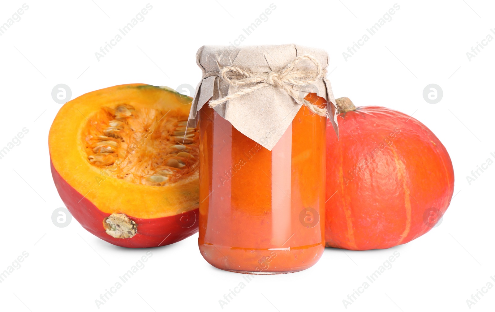 Photo of Jar of pumpkin jam and fresh pumpkins on white background