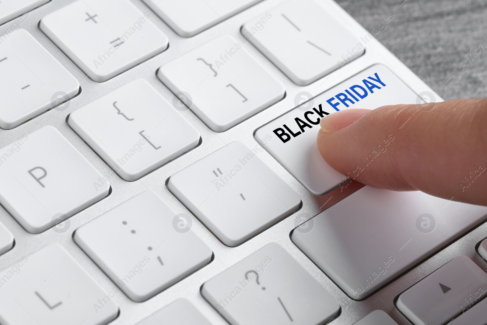 Image of Woman pressing Black Friday button on computer keyboard, closeup. Online shopping