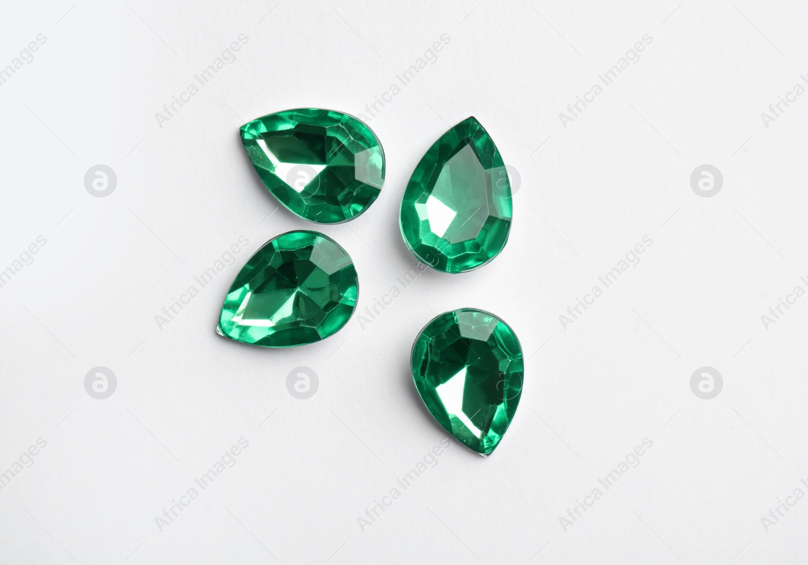 Image of Beautiful gemstones on white background, top view