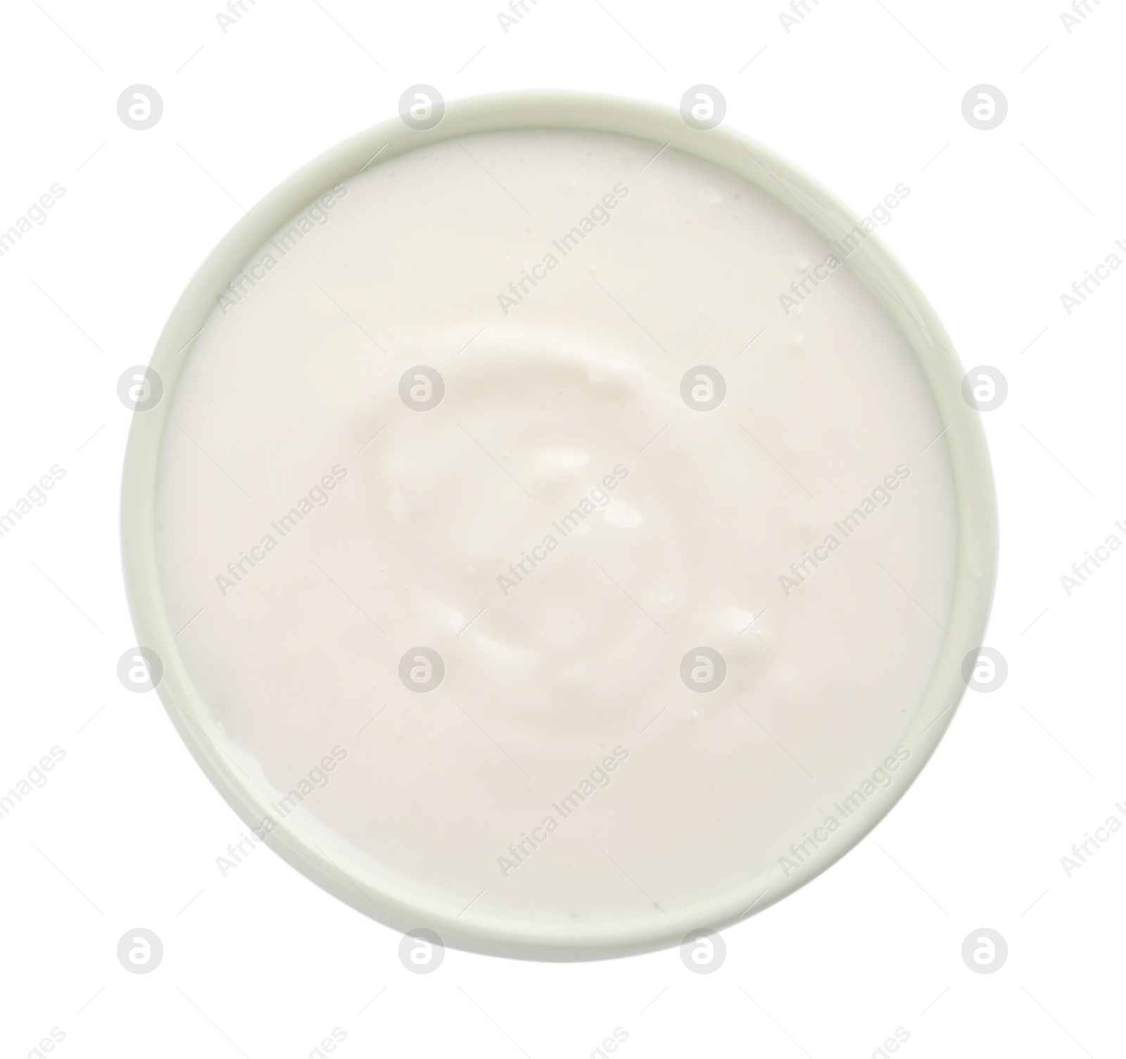 Photo of Delicious organic yogurt in bowl isolated on white, top view