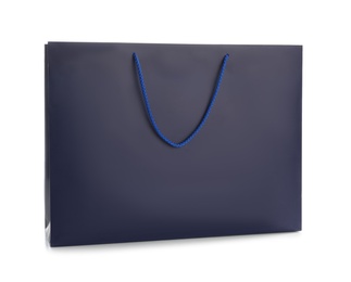 Photo of Dark blue paper shopping bag isolated on white