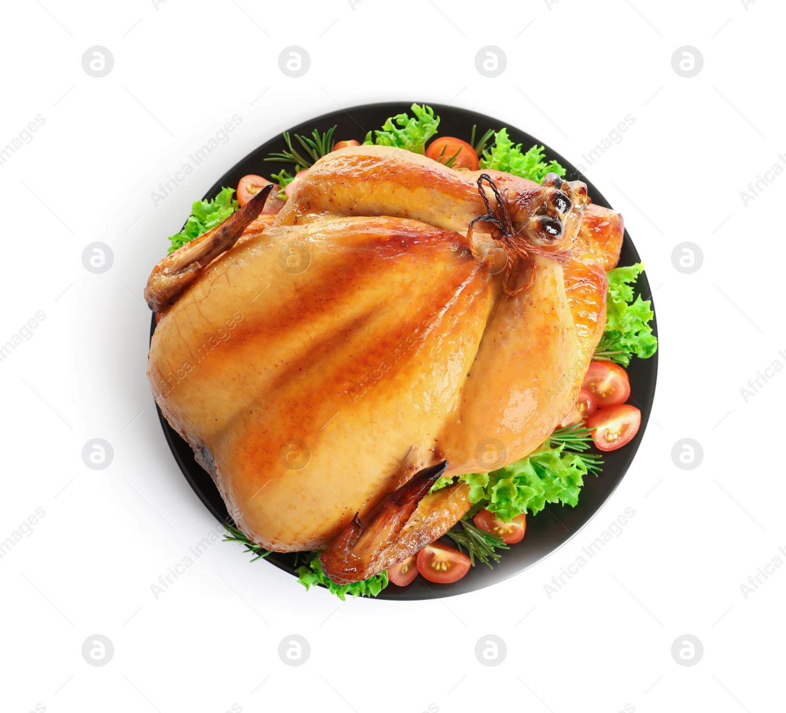 Photo of Platter of cooked turkey with garnish on white background, top view